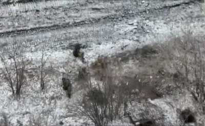 Almost synchronized drone dropped explosives land near a group of Russian soldiers, January 2023.