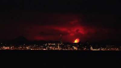Reykjavik skyline illuminated by a volcano