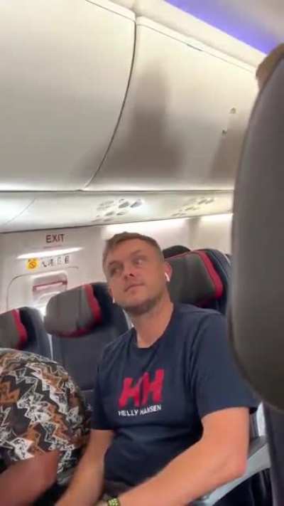 Airplane freakout, woman uses a laptop as a weapon...