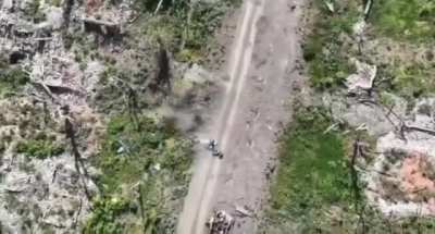 Accurate drone dropped grenade strike on a Russian soldier transporting potatoes on a motorbike