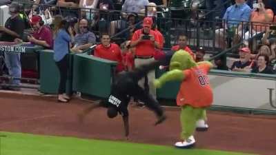 Mascot annoying security by dancing