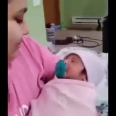 cute baby gets breastfed