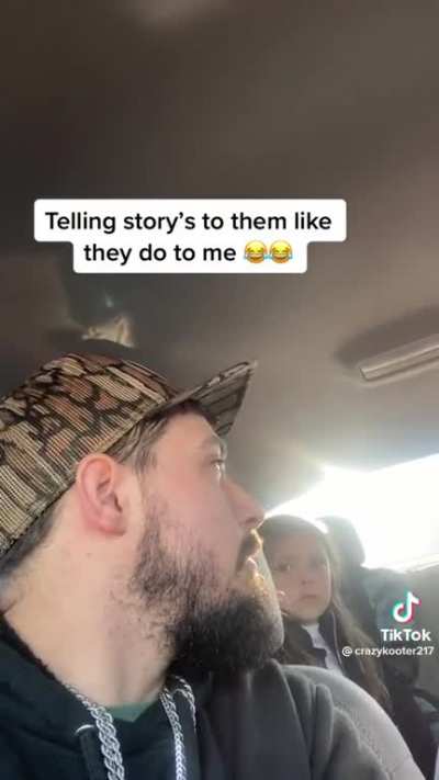 Dad telling his kids a story in the same way children do.