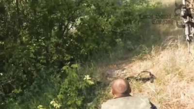 Ukranian SOF from the "Lukas Squad Company" evacuating Russian POWs come under small arms fire from Russians. 2 are KIA. (shooting starts at 0:40)