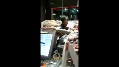 Crazy lady losing her shit in a petrol station and starts trashing the place