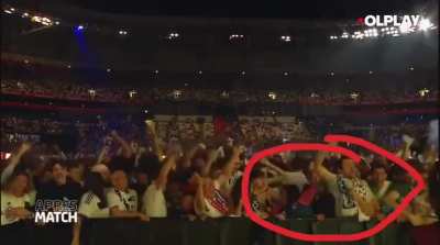 Soccer fan takes advantage of a stadium elation to repeatedly elbow a woman next to him 