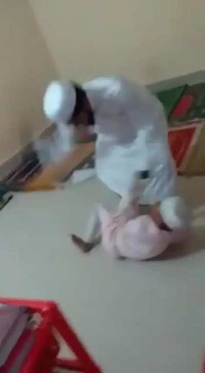 Teacher hitting student
