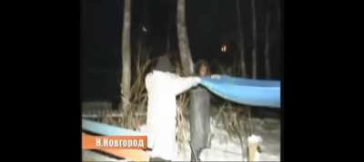 Russian soldier tries to rescue cat from tree