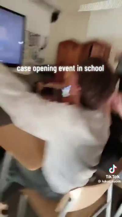Finnish high school students opening cases in class GOLD GOLD GOLD