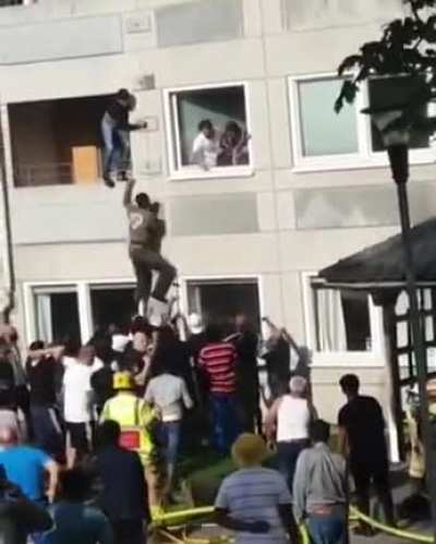 Saving a woman from a building on fire