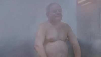 Just a man enjoying himself in the sauna.