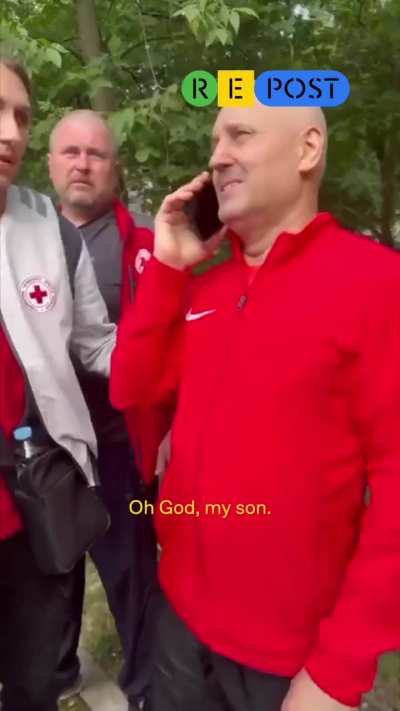 A father and mother are trying to reach their son near their home in Kharkiv, destroyed by the Russian army.