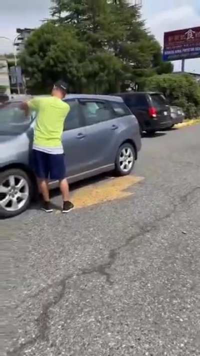 VANCOUVER, BC. Driver, locked out of car, decides to smash windshield instead of calling a tow truck.
