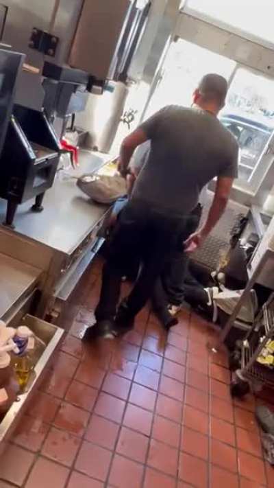 Two McDonald's employees giving each other a Mc Fisting and a Quarter Pounding