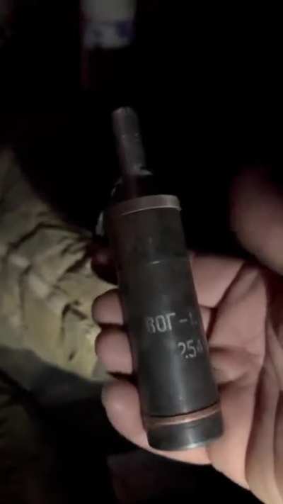 James Vasquez with an ancient hand made soviet grenade. The enemy is running low on munitions and has resorted to pulling such relics out of stores.
