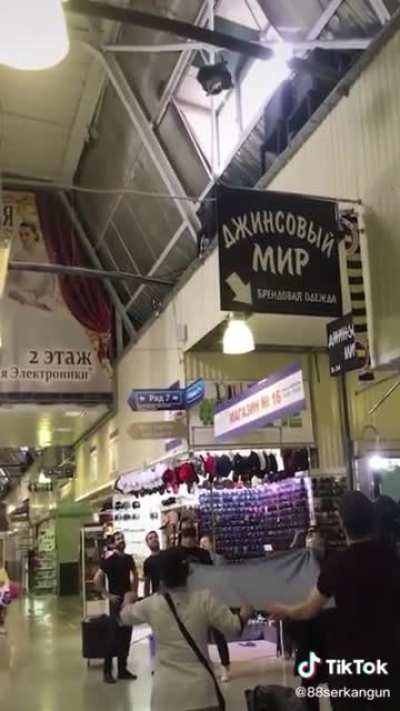 People saving a cat from falling down