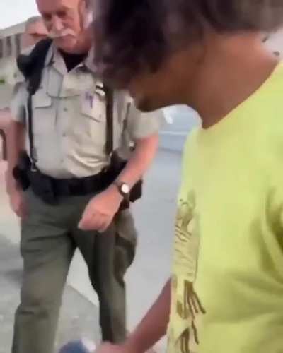 Cops get violent and arrest guy after he jokingly holds up a donut on a stick