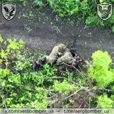 A Ukrainian drone drops two explosives on a Russian soldier. The first breaks his leg, while shrapnel from the second hits him in the head. "Aerobomber" and "Angry Peregrines" units, 30th Mechanized Brigade. Posted April 29th 2024, presumably in the Bakhm