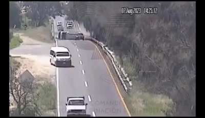 Van goes flying and lands on its side