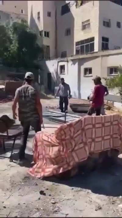 Israeli Settlers break into this women&rsquo;s land in Silwan and start installing a staircase under the protection of their army