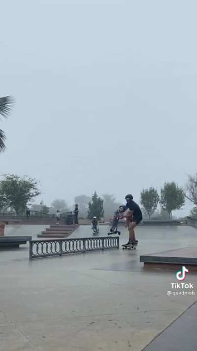 Showing the little one how to grind the rail at the skatepark