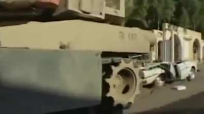 soldiers destroying a taxi for "stolen wood"...