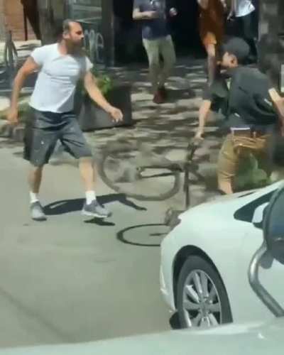 Biker slashes a man's tire after they got into an incident