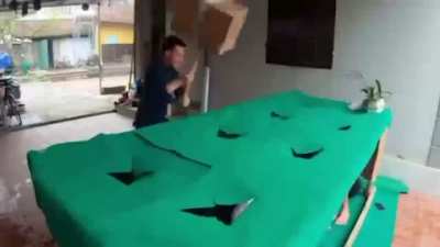 Playing Whack a Mole But With Humans Using a Cardboard Hammer
