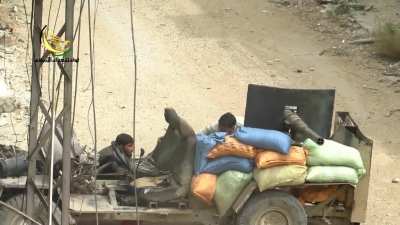 Cannibalized BMP cannon placed on a sandbagged and stripped truck used in Syria