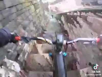 Biking down some stairs