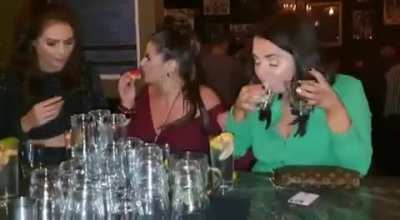 Girl does a shot of salt by mistake.
