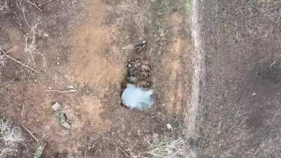 Large group of Russian soldiers in a ditch are hit with drone dropped grenade, Bahmut