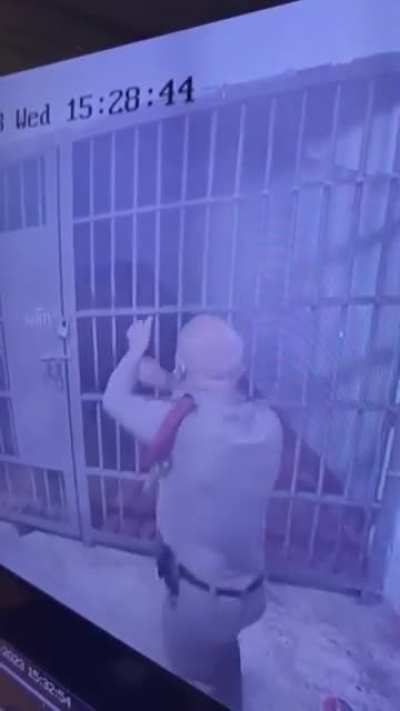 Thai police shot a loaded inmate from outside the holding cell, I think?