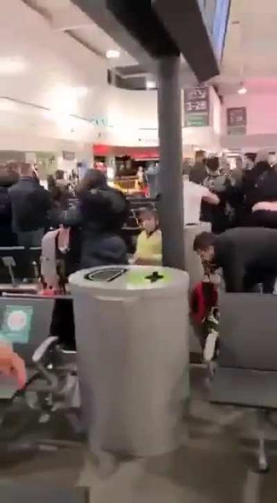 A public brawl breaks out in Luton Airport UK - 3 people hospitalized, 17 arrested.