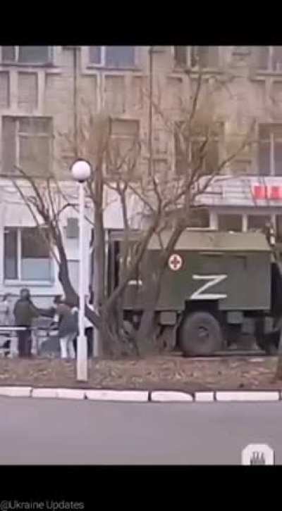 Ukrainian doctors taking care of a Russian soldier.