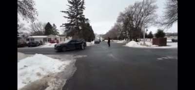 Federal agents arrest a woman for "impeding." A man nearby starts blowing a whistle while other observers honk their horns. The agents pepper-spray the man with the whistle. He continues, and they tackle him then arrest him 1/16/2026 - Minneapolis