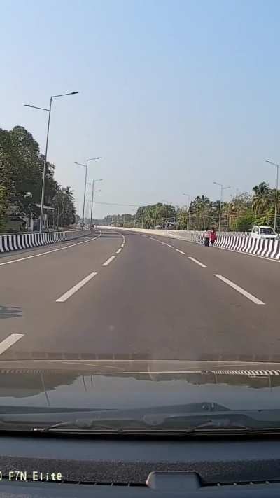 Walks on the middle of newly built highway without facing the traffic [OC]