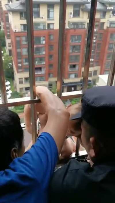 Baby struck in a high rise window rescued
