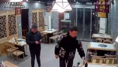 Guy casually drinking beer gets hit by a bull