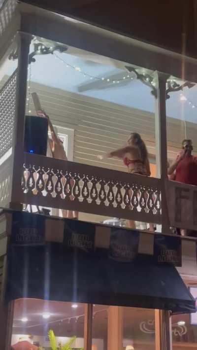 Getting flogged on a balcony at Fantasyfest