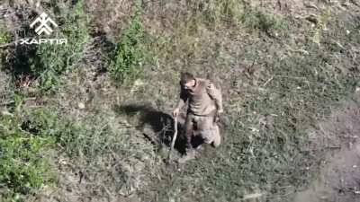 UAV of "Khartia" brigade noticed wounded russian which decides to surrender. The drone drops him water and instructions then leads him to Ukrainian positions (Kharkiv direction)