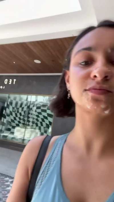 Girl walking with cum at the mall