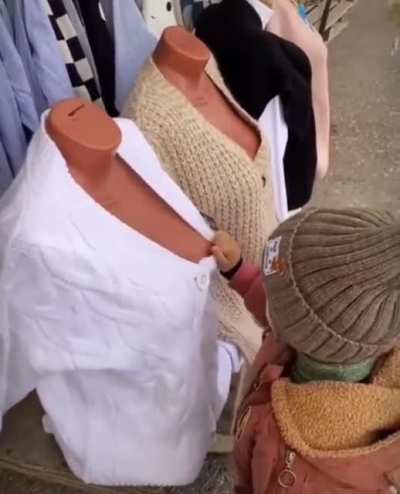 Kid learns early on that not all boobies are real.