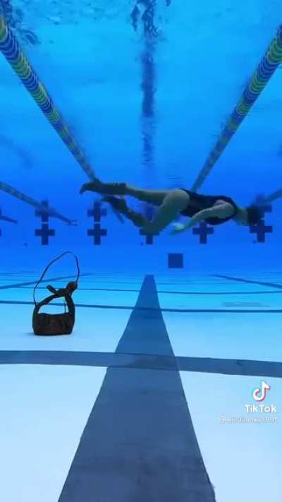 She does an 360 underwater mime walk in heels.