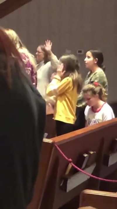 Girl doing Macarena during Sinner&rsquo;s Prayer