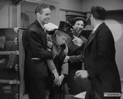 Groucho orders food for his stowaway guests (Chico, Harpo, Not-Gummo), then sees how many people they can squeeze into the smallest cabin aboard ship. From the 1935 Marx Brothers comedy "A Night at the Opera".