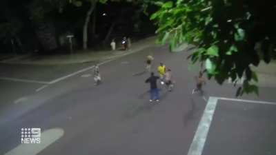 Man runs over his victim with a car and gets caught and beat when he can't get away.