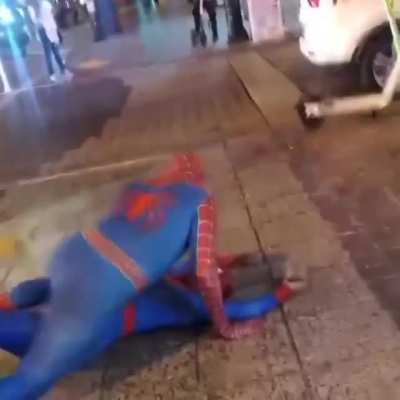 Spider-Man and Spider-Woman getting freaky in the streets