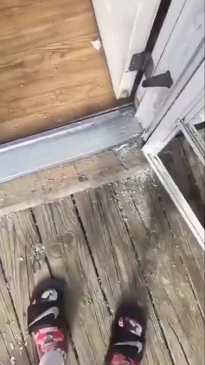 Boy breaks glass door using a BB gun and then runs away before mom comes back home. Brother documents the events.