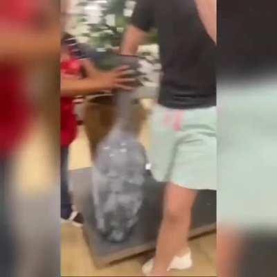 Teenager gets arm stuck in vase in a store